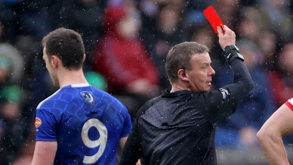 Monaghan midfielder Killian Lavelle is given a straight red card by referee Joe McQuillan