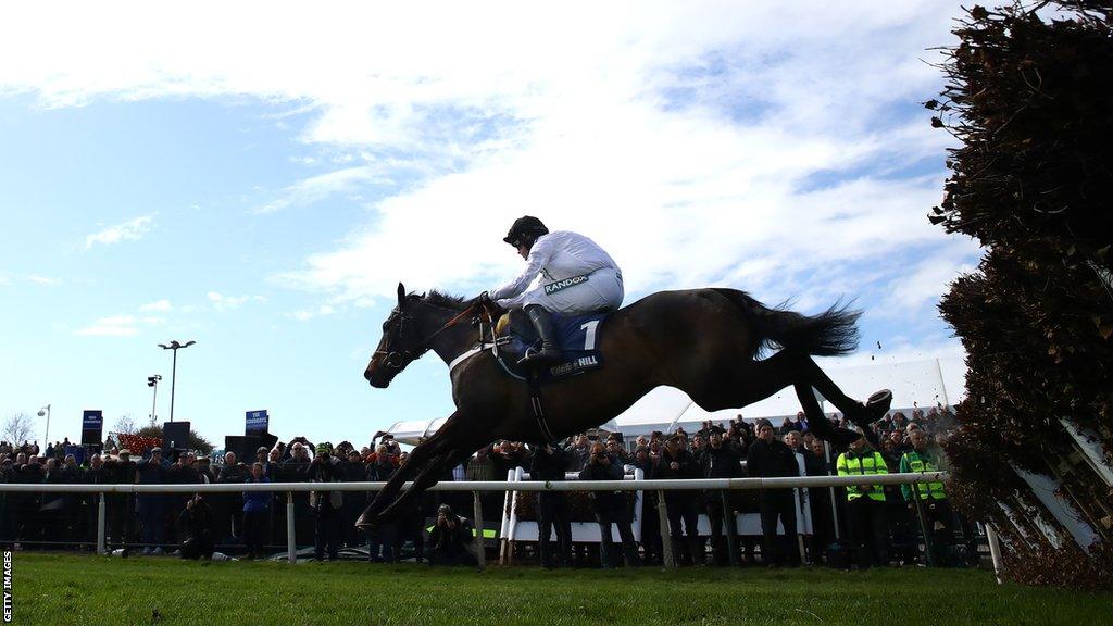 Nico de Boinville and Constitution Hill jump one of the Aintree hurdles