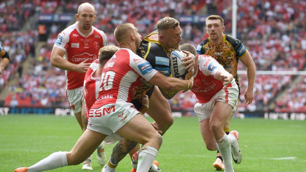 Hull KR defenders try to stop Leigh winger Josh Charnley in the Challenge Cup final at Wembley