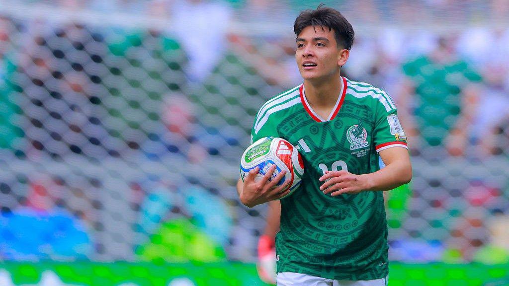 Mexico's Gilberto Mora holds the ball during their win over South Africa