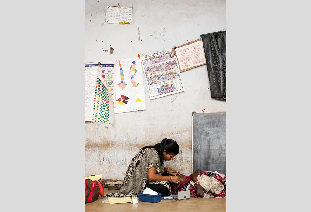 Patient receiving treatment during outreach eye screening in India