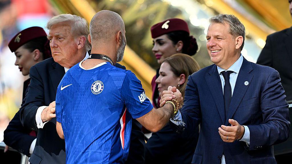 Todd Boehly congratulates Enzo Maresca during the award ceremony following the Club World Cup final