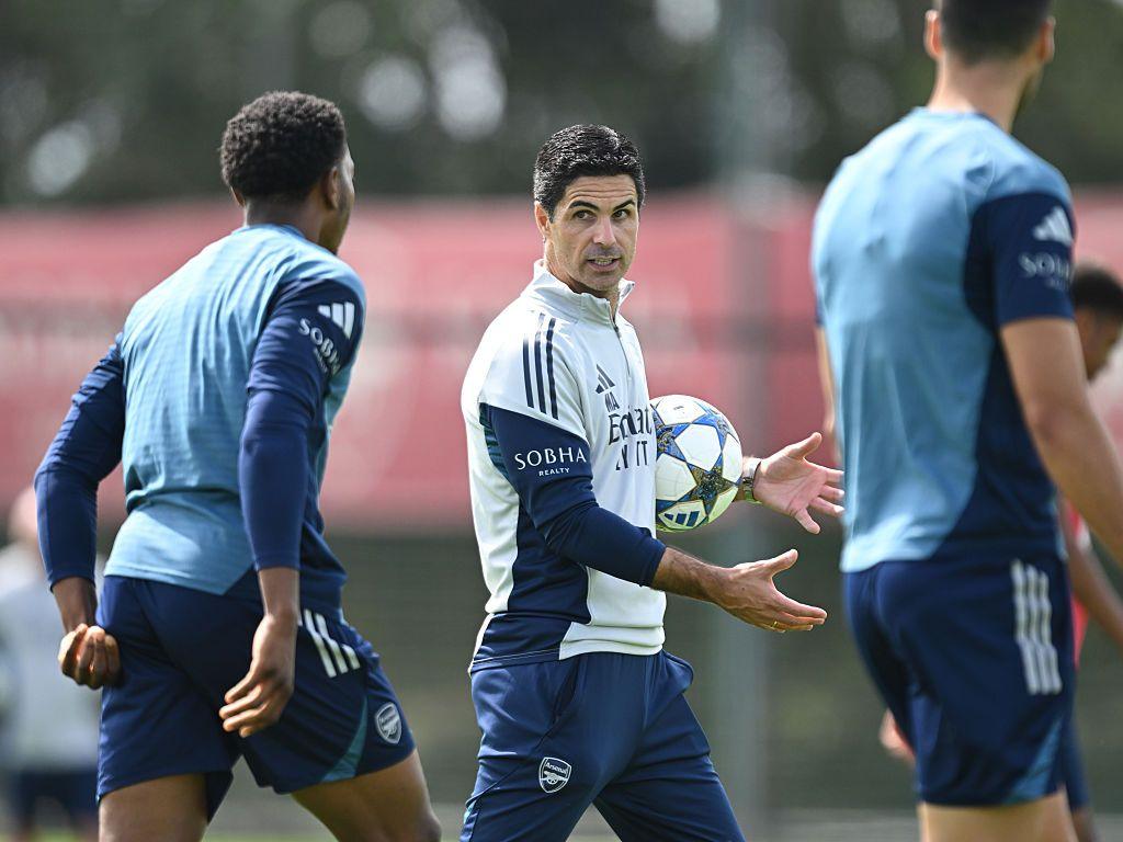Arsenal manager Mikel Arteta carrying a football