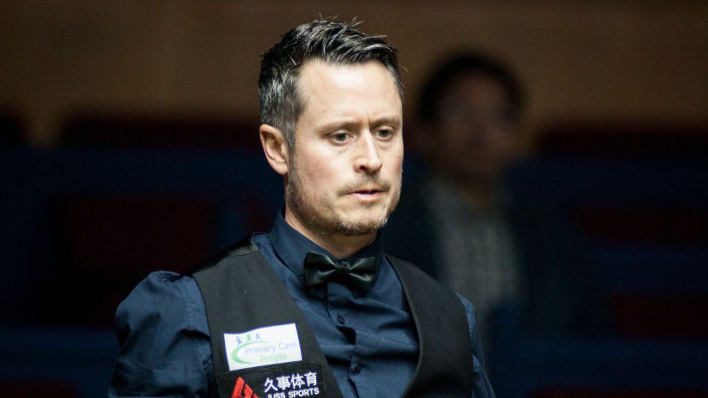 Alfie Burden wearing a waistcoat and shirt