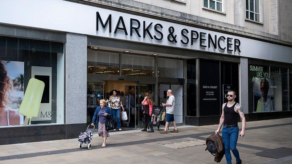 Shoppers and people outside Marks & Spencer in Swansea