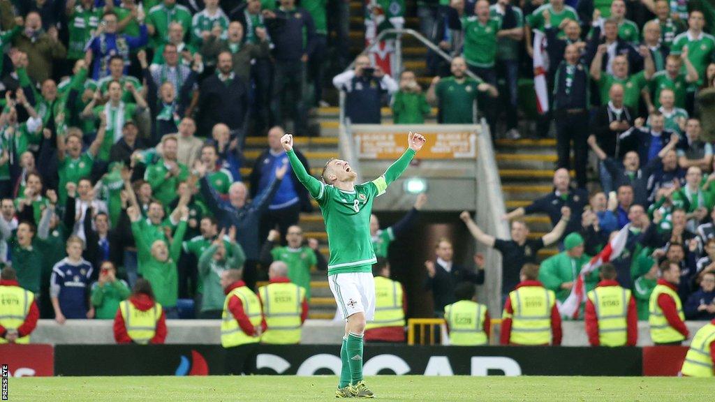 Steven Davis celebrates after Northern Ireland beat Greece