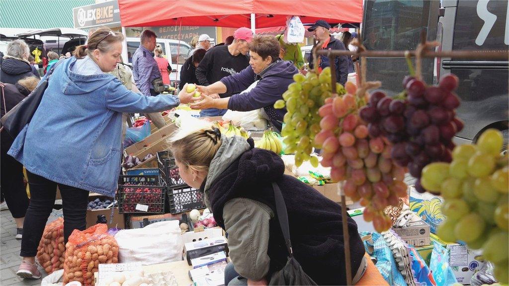 Street vendor sells fruit at the central market in Melitopol, Zaporozhzhia region, 10 September, 2022