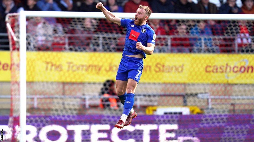 Harrogate Town's George Thomson celebrates scoring their side's second goal against Leyton Orient