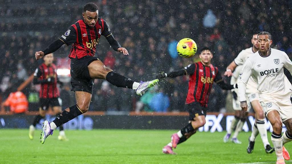 Eli Junior Kroupi taking a shot in a game for Bournemouth against West Ham