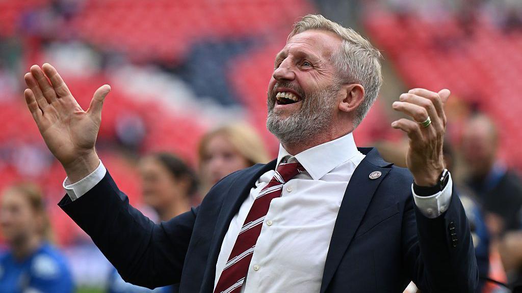 Wigan Warriors coach Denis Betts celebrates at the end ofthe Betfred Women's Challenge Cup Final match after victory over St Helens at Wembley Stadium 