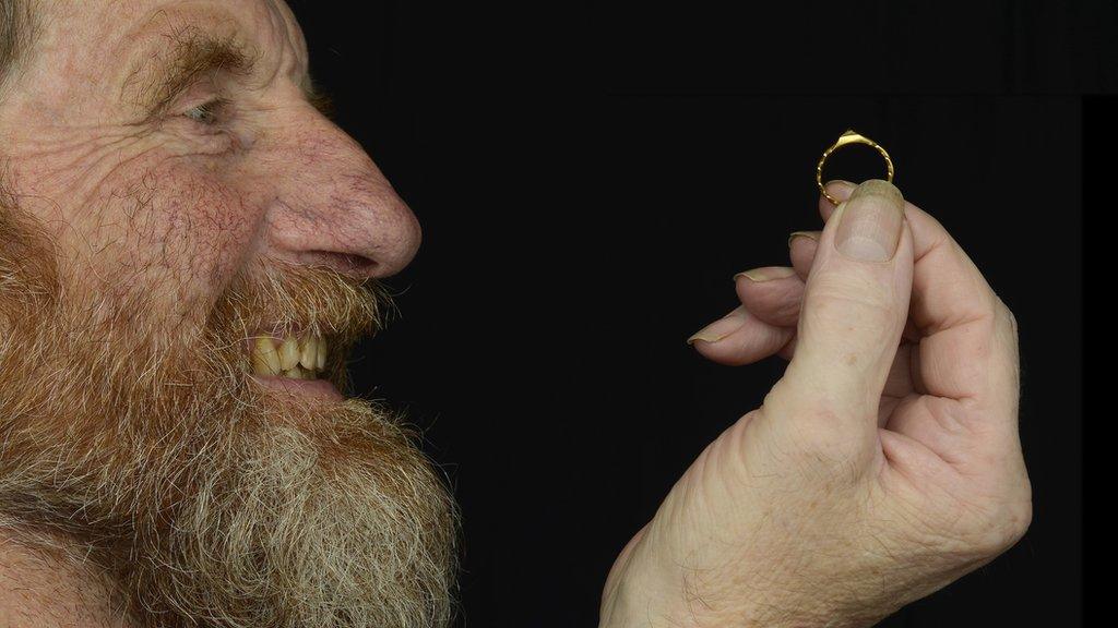 David Board with the medieval gold ring he found