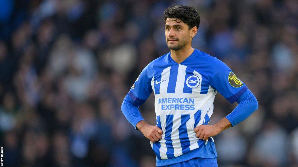 Mahmoud Dahoud stands with his hands on his hips