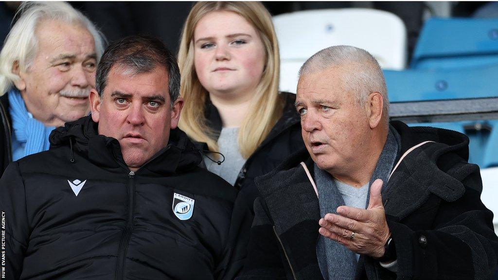 Richard Holland (left) in conversation with Wales head coach Warren Gatland