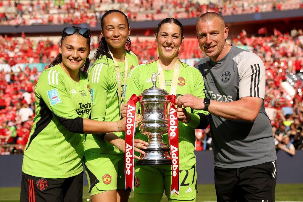 The Manchester United goalkeeping group from last season holding the Women's FA Cup