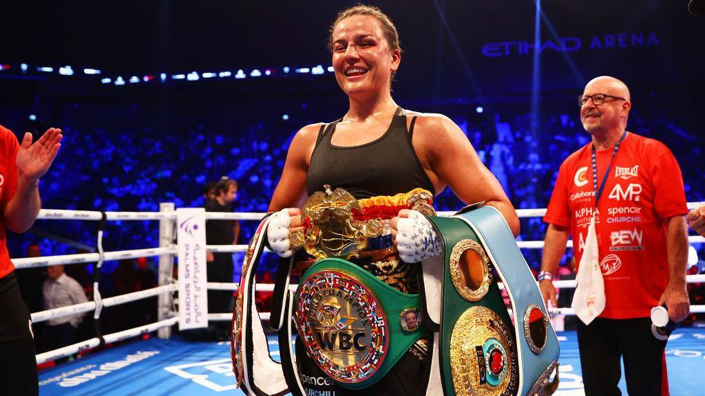 Chantelle Cameron with world title belts