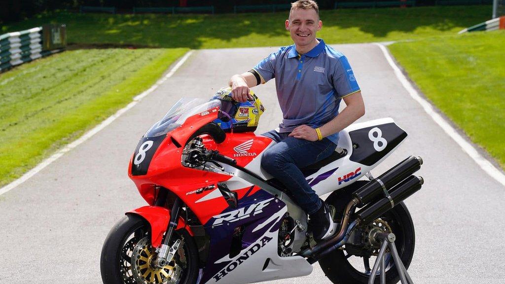 Nathan Harrison sitting on the Ashcourt Racing Honda RC45