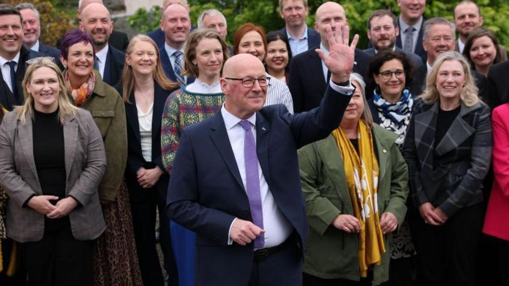 Man waves upwards