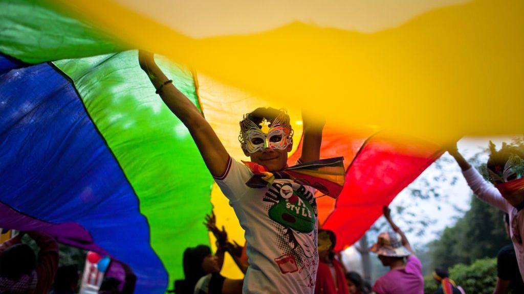 A boy dances as he and others participate during the 4th Delhi Queer Pride 2011 March on November 27, 2011 in New Delhi, India