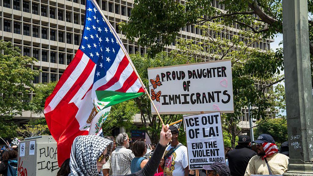Demonstrators fill the street with signs and flags in Los Angeles, California on June 14, 2025