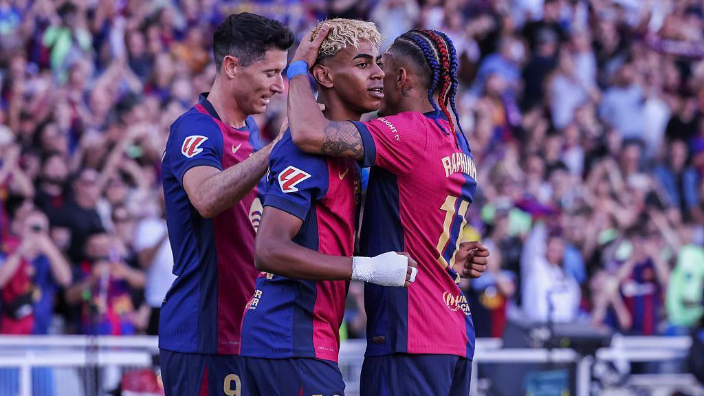 Barcelona players celebrate a goal
