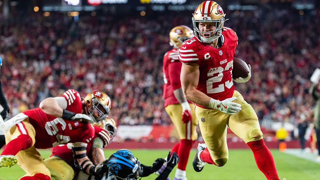 Christian McCaffrey runs with the ball during the San Francisco 49ers game with the Carolina Panthers 