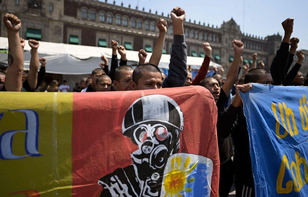 Students take part in a protest over the disappearance of the 43 students of the Ayotzinapa teaching training school in 2014 in front of the Palacio Nacional (National Palace) in Mexico City on March 6, 2024.