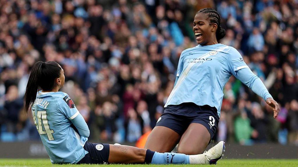 Kerolin and Khadija Shaw celebrate for Manchester City