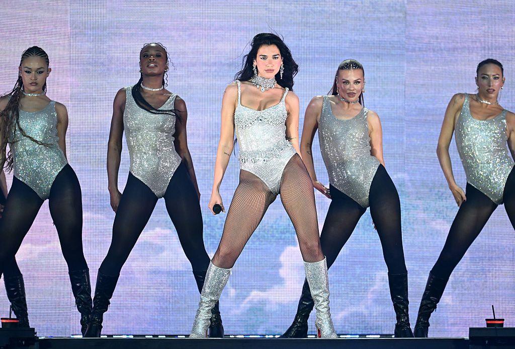 Dua Lipa and her dancers stand in formation during her show at Wembley Stadium