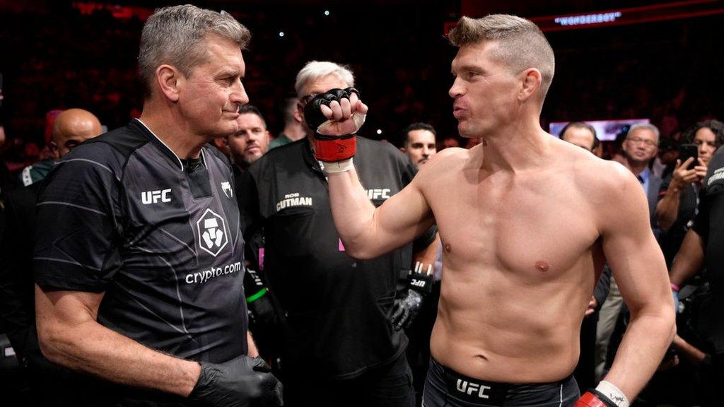 Stephen Thompson and his father fist bump before a fight