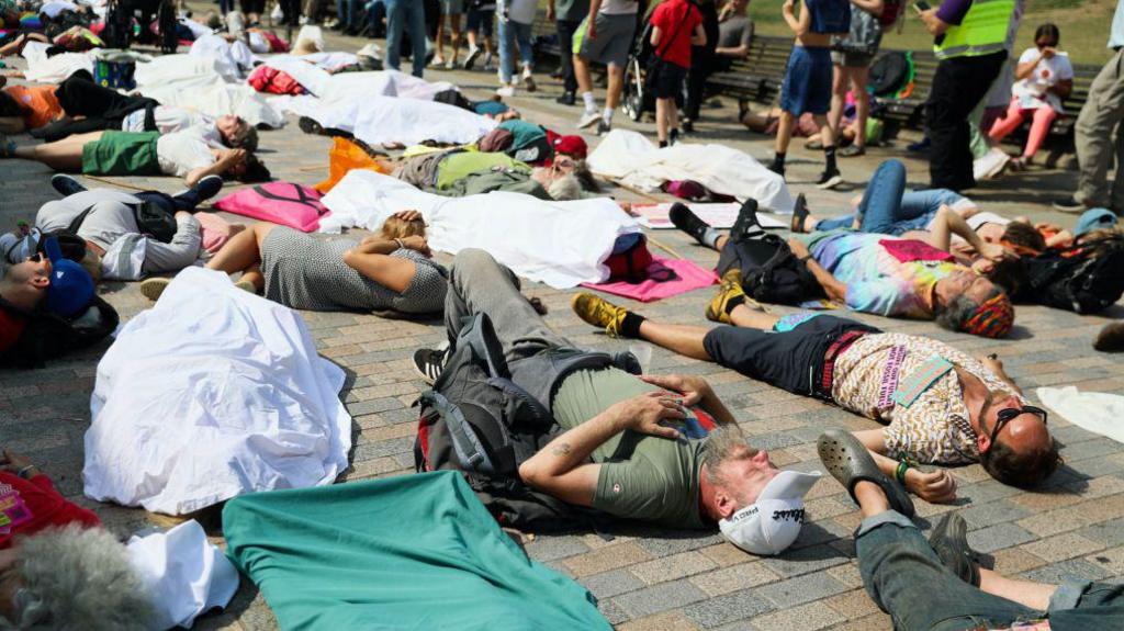 Members of Extinction Rebellion lay on the streets outside of Windsor Castle on September 1, 2024 in Windsor.