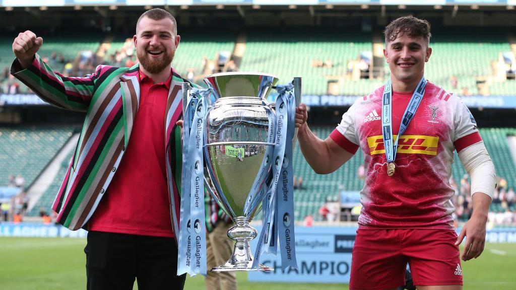 George Head [left] and Cadan Murley lift the 2020-21 Premiership trophy