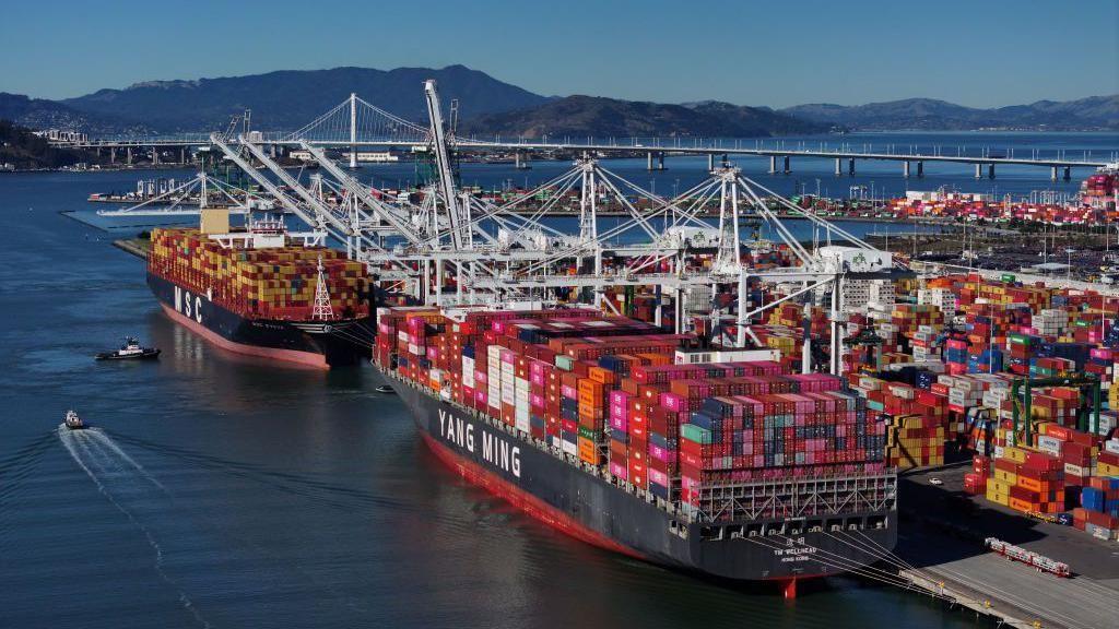 Container ships docked at the Port of Oakland in California