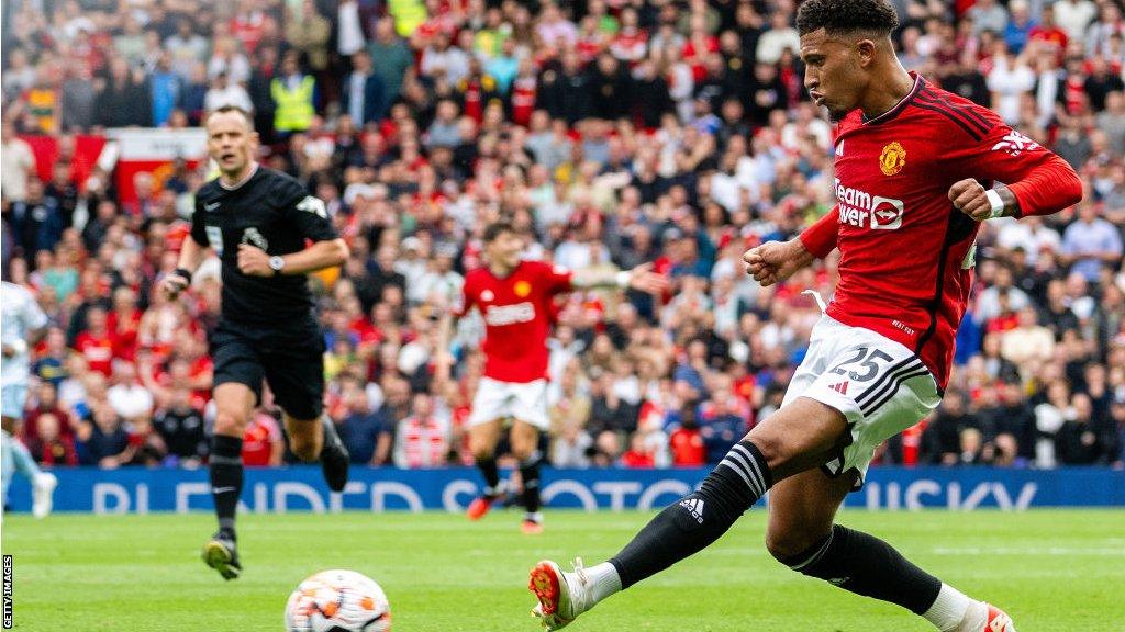 Jadon Sancho takes a shot for Manchester United