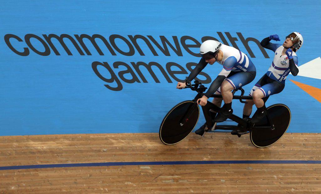 Scotland's Neil Fachie celebrates with pilot Lewis Stewart after winning the men's para-sport 1000m B time trial tandem cycling final on day one of the Commonwealth Games