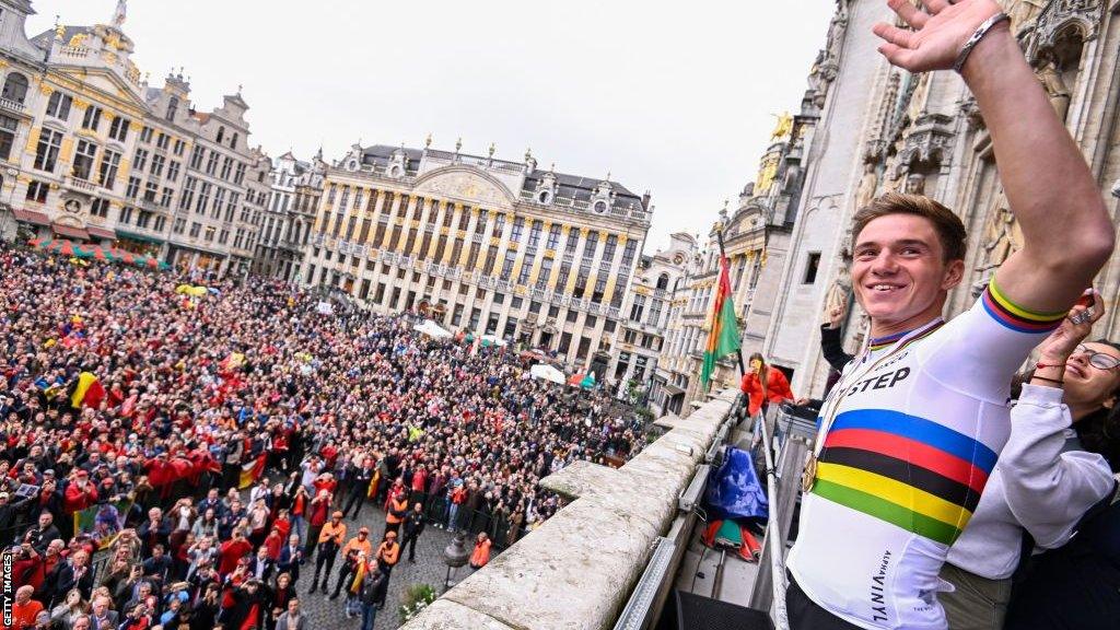 Belgian Remco Evenepoel, new cycling world champion waves at the crowd from a balcony overlooking the Grande Place during celebrations after his return from the UCI Road World Championships Cycling 2022,