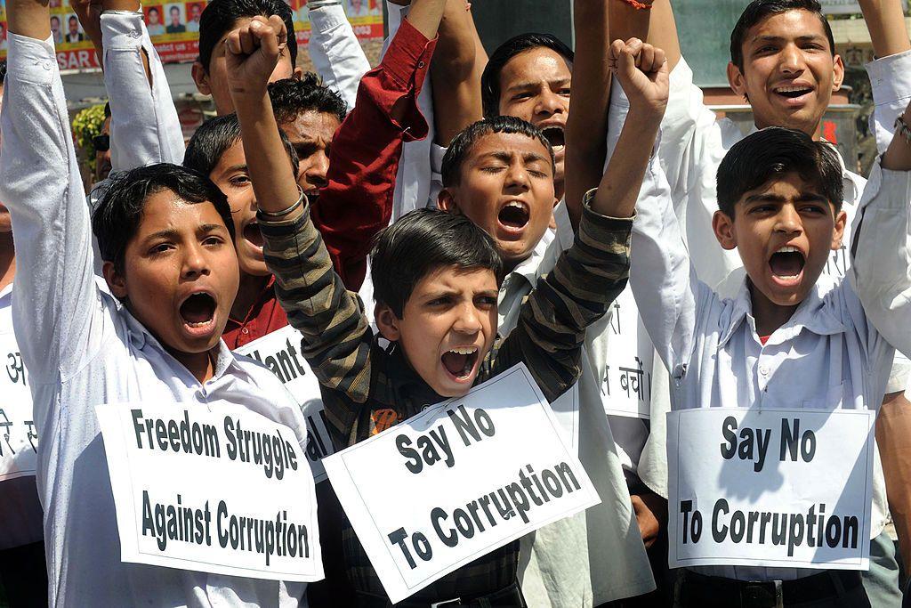 
Indian students shout anti-corruption slogans in support of veteran Indian social activist, Anna Hazare at a garden in Amritsar on April 8, 2011.