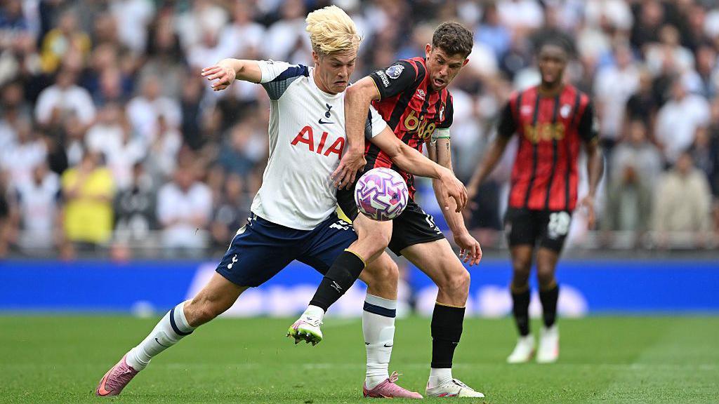 Lucas Bergvall of Tottenham Hotspur battles for possession with Ryan Christie of AFC Bournemouth during the Premier League match between Tottenham Hotspur and Bournemouth at Tottenham Hotspur Stadium on August 30, 2025 in London, England.