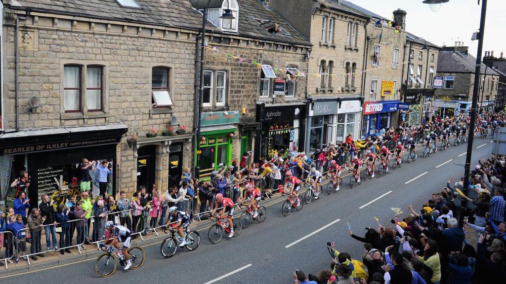 Tour de France cyclists on a road in Yorkshire.