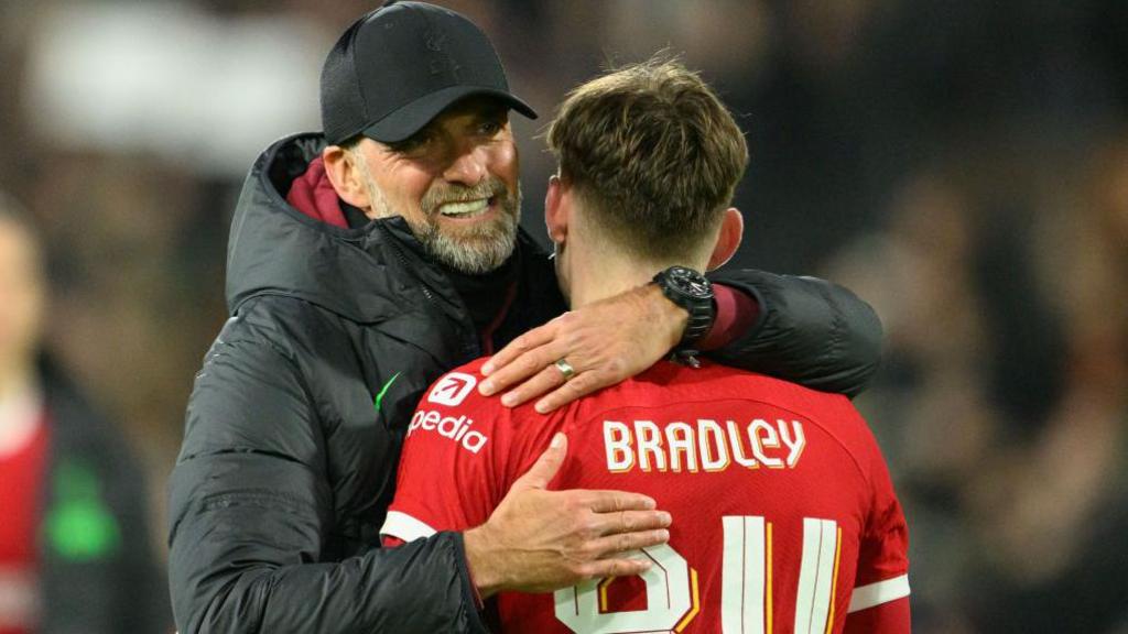 Liverpool boss Jurgen Klopp hugs Conor Bradley