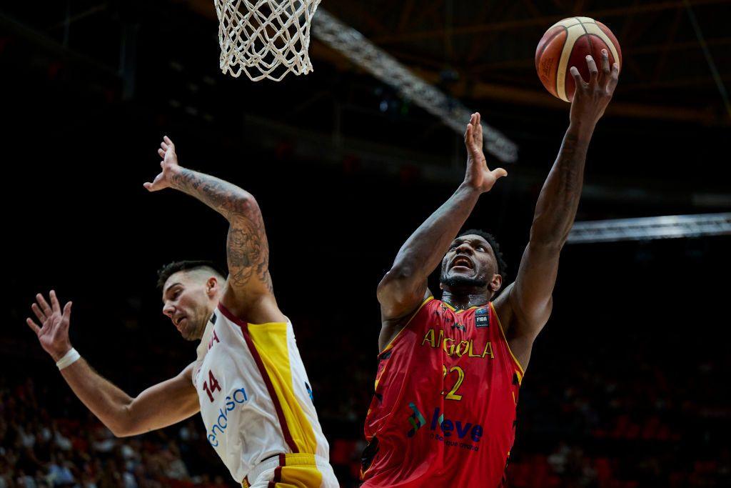 Angola's Silvio De Sousa and Spain's Willy Hernangomez vye for the ball during an Olympic basketball qualifier on Wednesday.