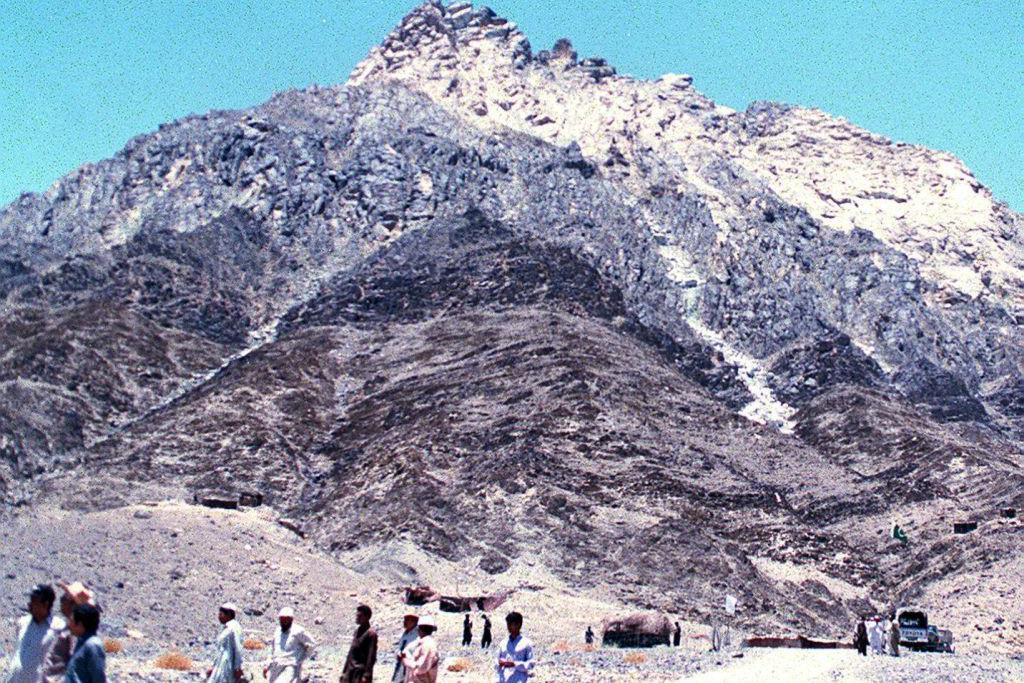 A view of Chaghi district hill which turned white from top after Pakistan tested its five nuclear devices on May 28, in the southwestern Baluchistan province, 19 June. Prime Minister Nawaz Sharif visited the site first time after Pakistan's six nuclear explosions in response to nuclear detonations by rival India. (Photo credit should read ZULFIQAR BALTI/AFP via Getty Images)