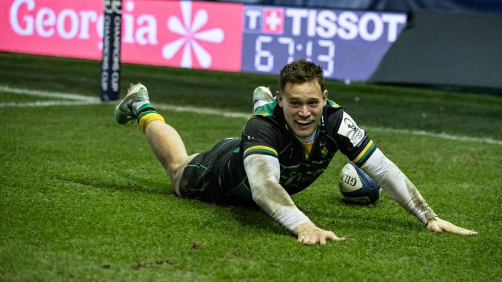 Tom Seabrook lands on all fours after diving over the line for a try for Northampton Saints