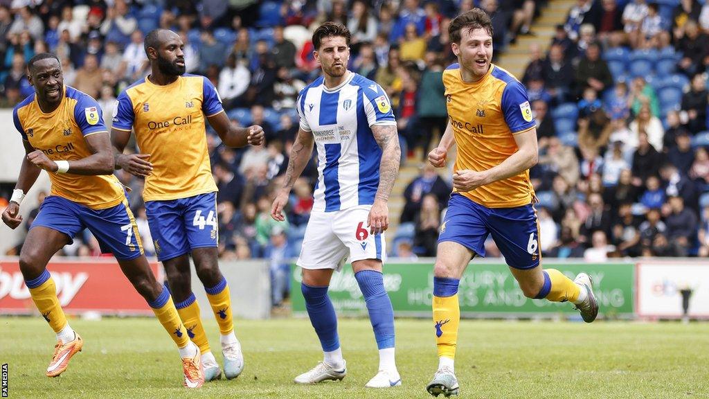 Riley Harbottle (right) celebrates with Mansfield Town