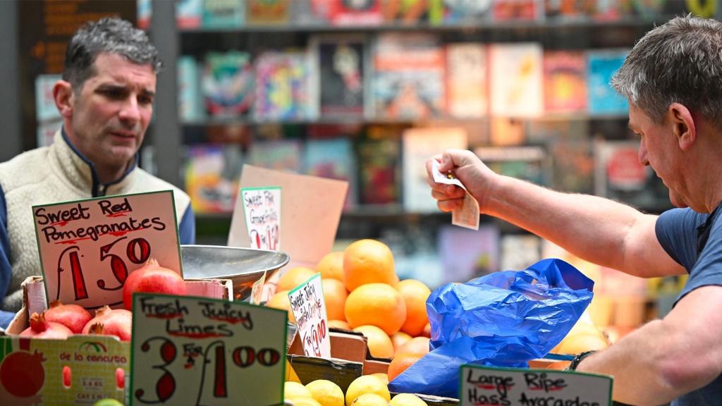 Market stall traders in London in May 2022