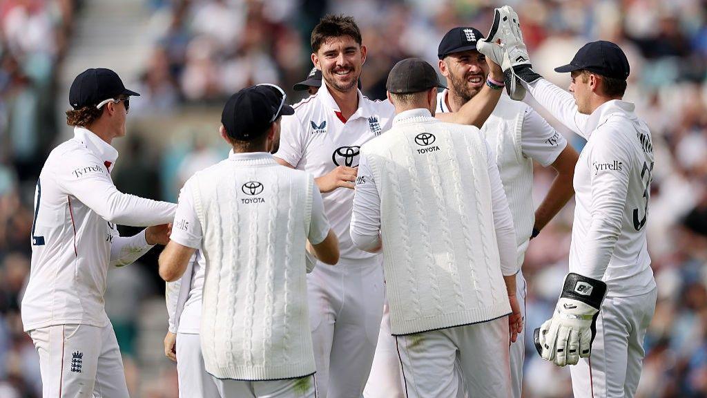 Josh Tongue celebrates with England teammates after taking a wicket against India