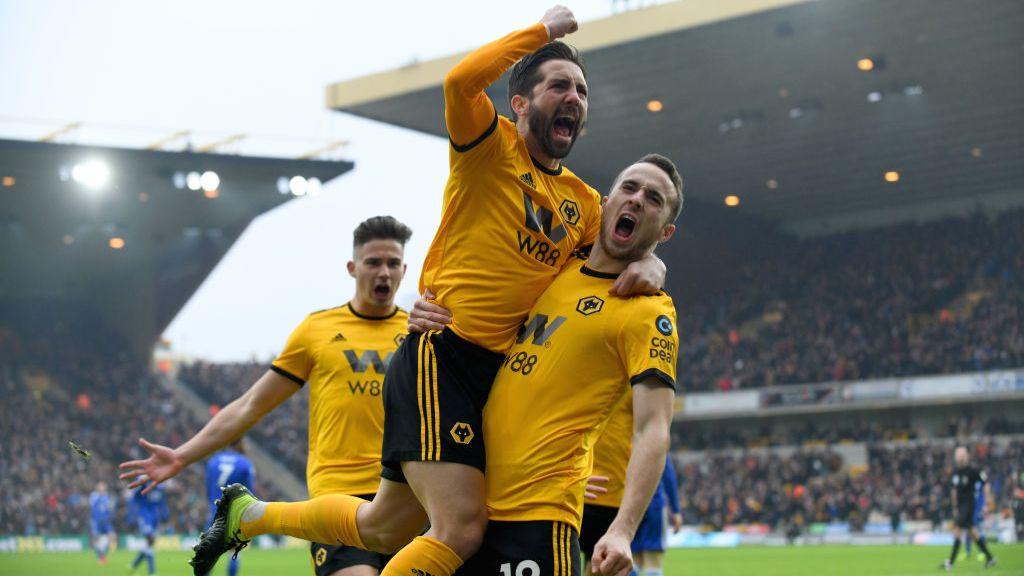 Diogo Jota celebrates scoring the first goal in his hat-trick against Leicester City