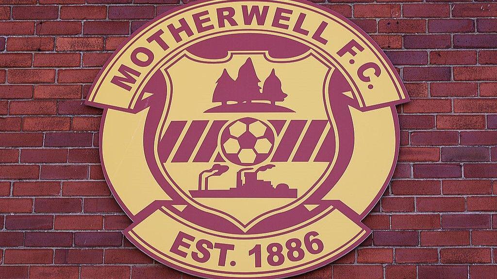 Motherwell badge on wall