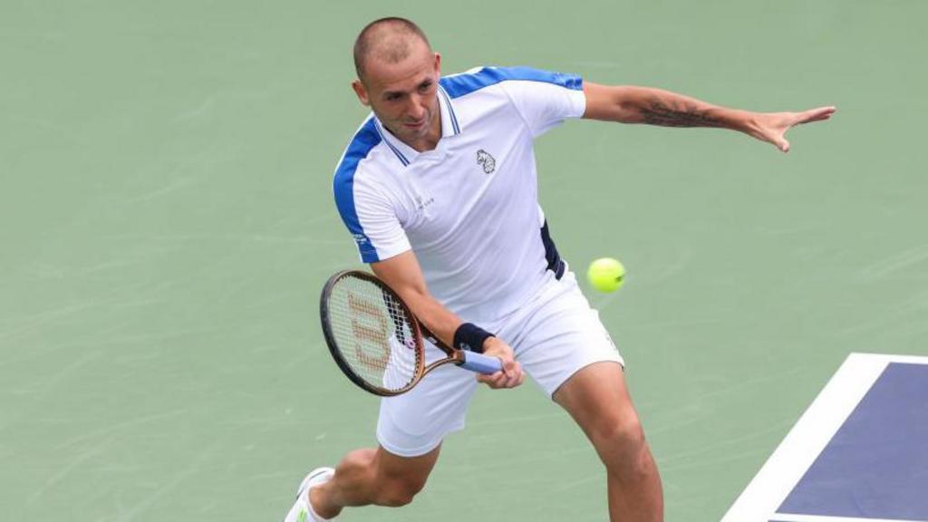 Briton Evans loses in first round in Dubai