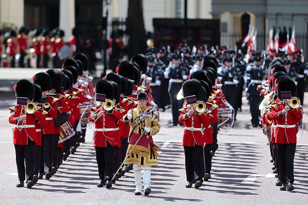 Musicians march in a procession ahead of king's birthday parade