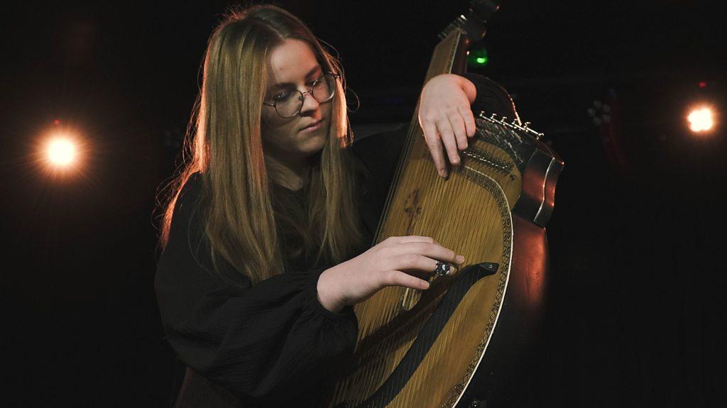 Viktoriia playing the bandura